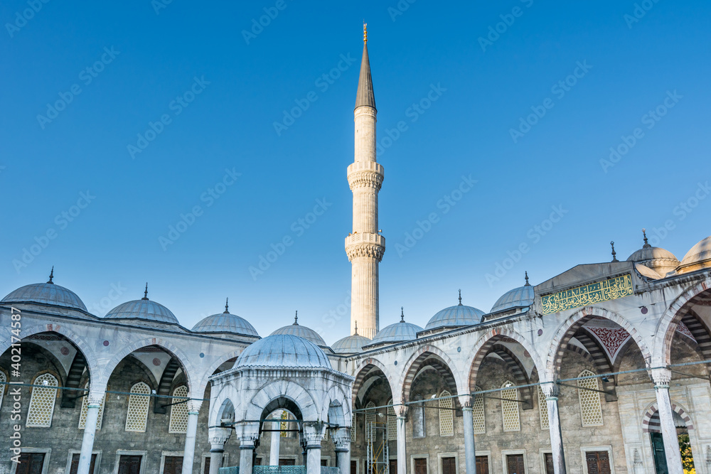 Single minaret against blue sky at the corner of  blue Mosque also called the Sultan Ahmed Mosque or Sultan Ahmet Mosque in Istanbul, Turkey