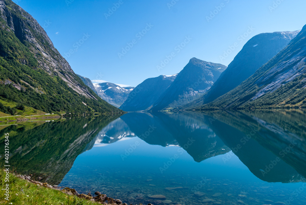 Fototapeta premium Mountain reflection on a lake in Norway at Sogndal Fjord.