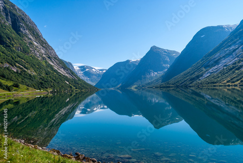 Fototapeta Naklejka Na Ścianę i Meble -  Mountain reflection on a lake in Norway at Sogndal Fjord.