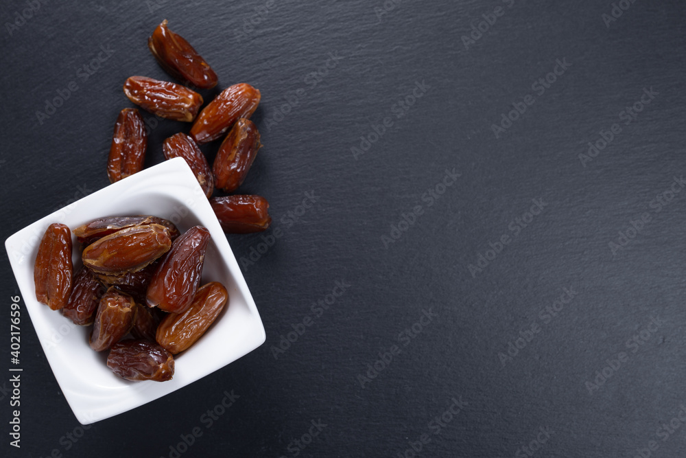 dates. dried fruits on a stone slab. top view. copy space dates. dried fruits on a stone slab. top view. copy space