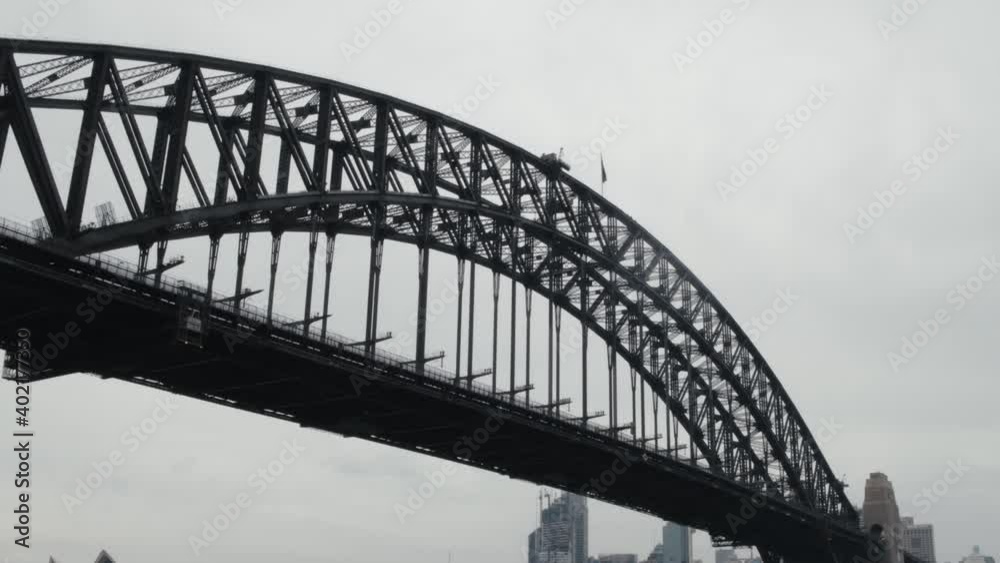 Sydney Harbour Bridge On A Cloudy Day From Sydney Harbour In Sydney, New South Wales, Australia. - low angle