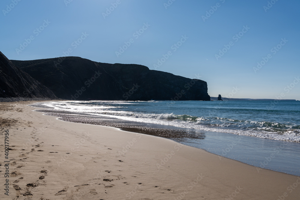 the bay at Arrifana with ist golden beach and steep cliffs the bay at Arrifana with ist golden beach and steep cliffs