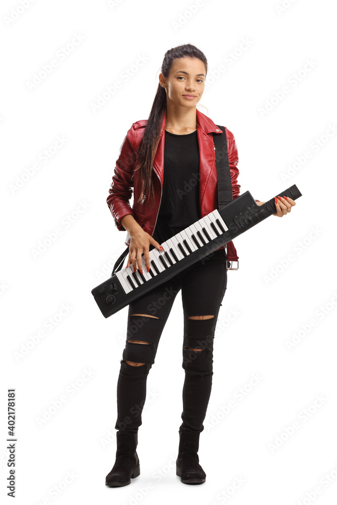 Full length portrait of a female musician playing a keytar and standing Full length portrait of a female musician playing a keytar and standing