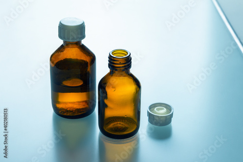 Medical bottles on glass table