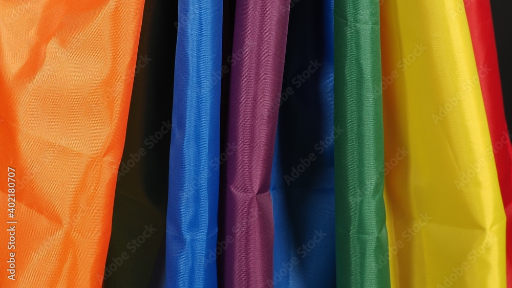 LGBTQ flag or Lesbian Gay Bi sexsual Transgender Queer or homosexsual pride Rainbow flag on black background. Represent hand symbol of freedom, peace, equality and love. LGBTQ concept