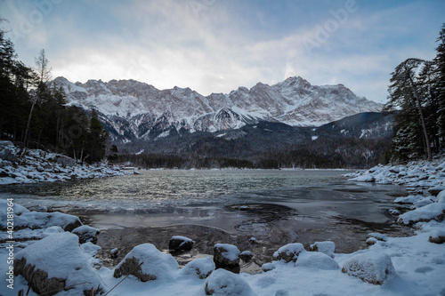 The lake "Eibsee" in winter with the "Zugspitze" (The highest mountain of Germany ) in the background. 