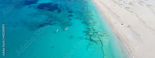 Aerial drone ultra wide panoramic photo of tropical exotic beach with deep turquoise crystal clear sea
