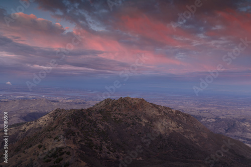 Twilight Sky over North Peak via Main Peak. In the background is Antioch on the left, and Brentwood to the right. Mt Diablo State Park, Contra Costa County, California, USA.