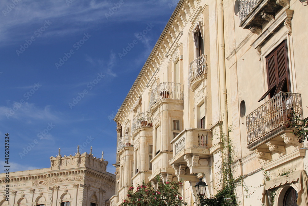 baroque architecture, Syracuse, historic buildings with ornaments and decorations, balconies and wooden shutters