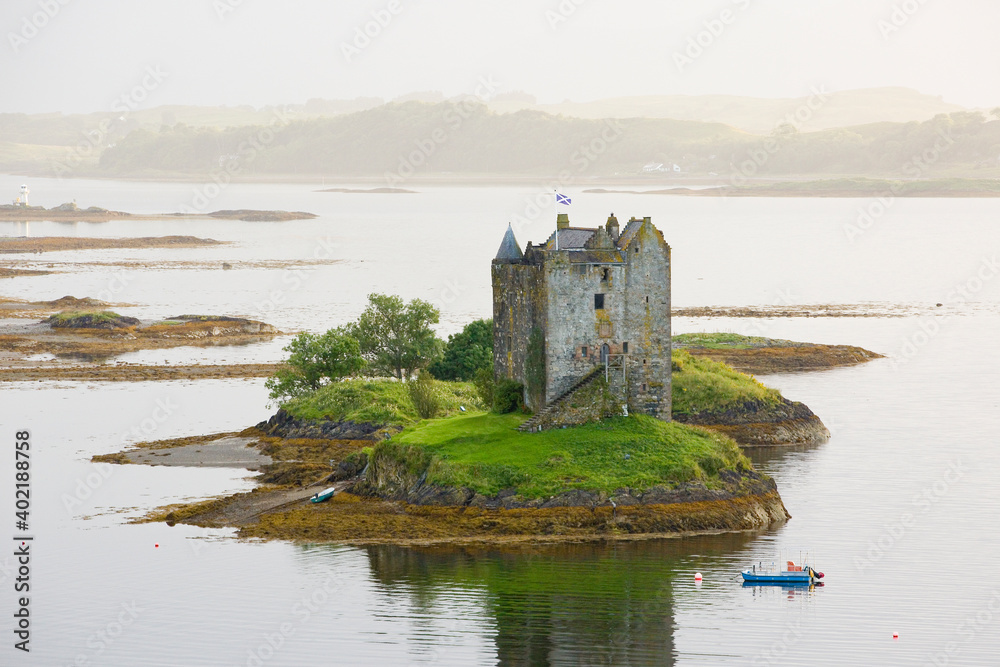 Stalker Castle, a four storey tower house or keep picturesquely set on a tidal islet on Loch Laich, Port Appin, Argyll, Scotland.