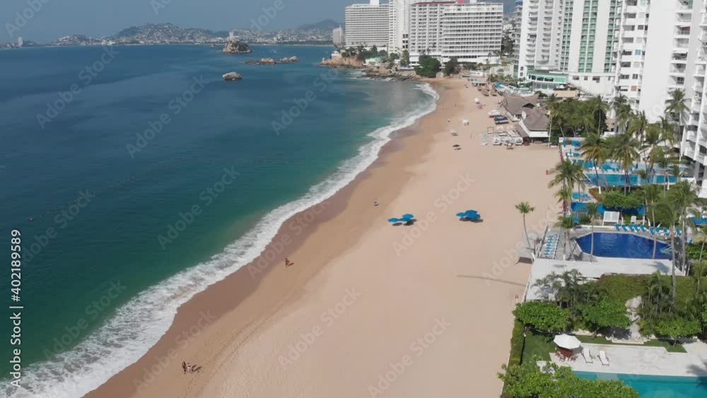 Dron flying at the beach near the hotels and pools Dron flying at the beach near the hotels and pools
