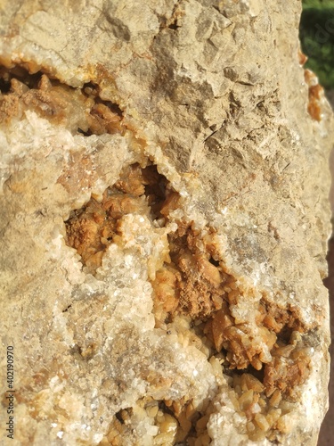 closeup photo of limestone with quartz secretion inside. Quartz in a limestone cavern