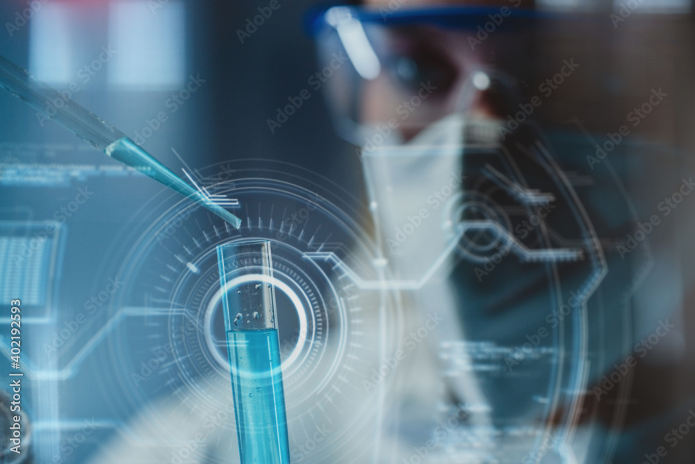 Close-up of test glass and female lab technician in safety goggles and mask pipetting out chemicals in developing anti-coronavirus vaccine or treatment. Incorporated futuristic interface