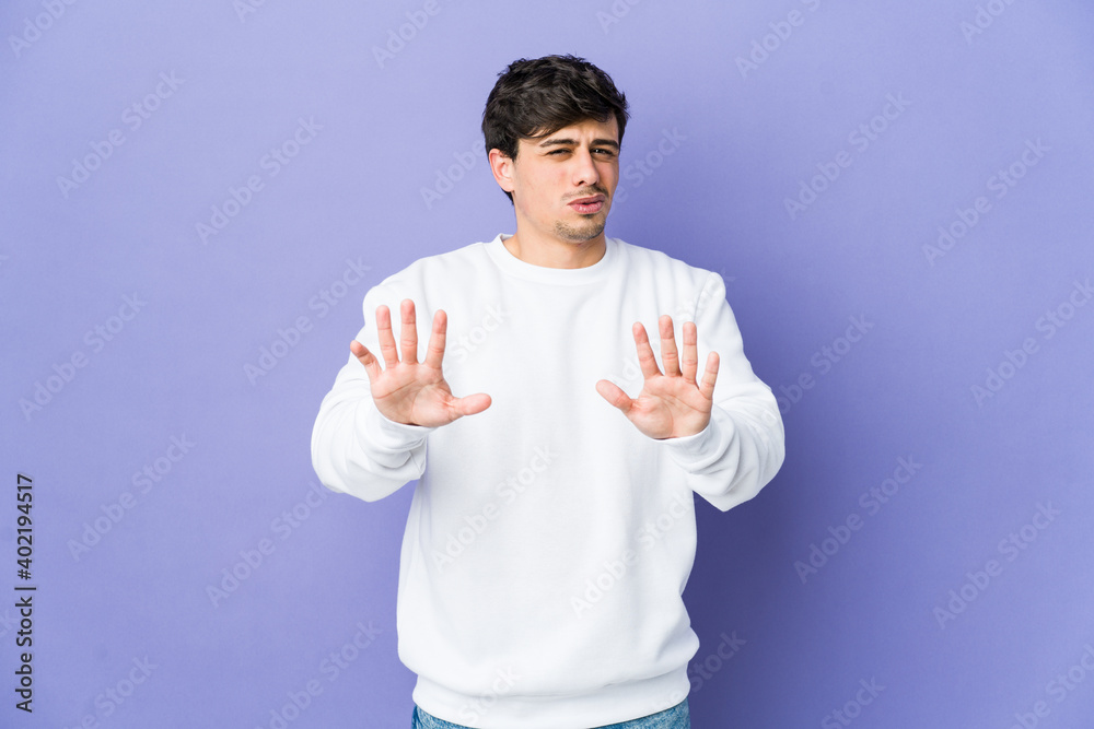 Young cool man rejecting someone showing a gesture of disgust. Young cool man rejecting someone showing a gesture of disgust.