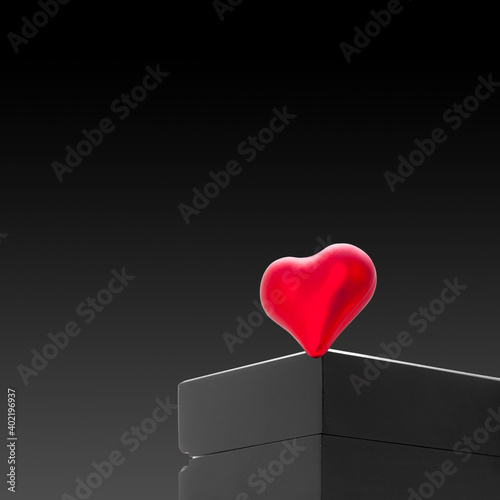 red heart of love and devotion on a black wooden gift box, poster Valentine's Day backdrop with decor objects isolated on black gradient background with copy space, nobody. © Александр Беспалый