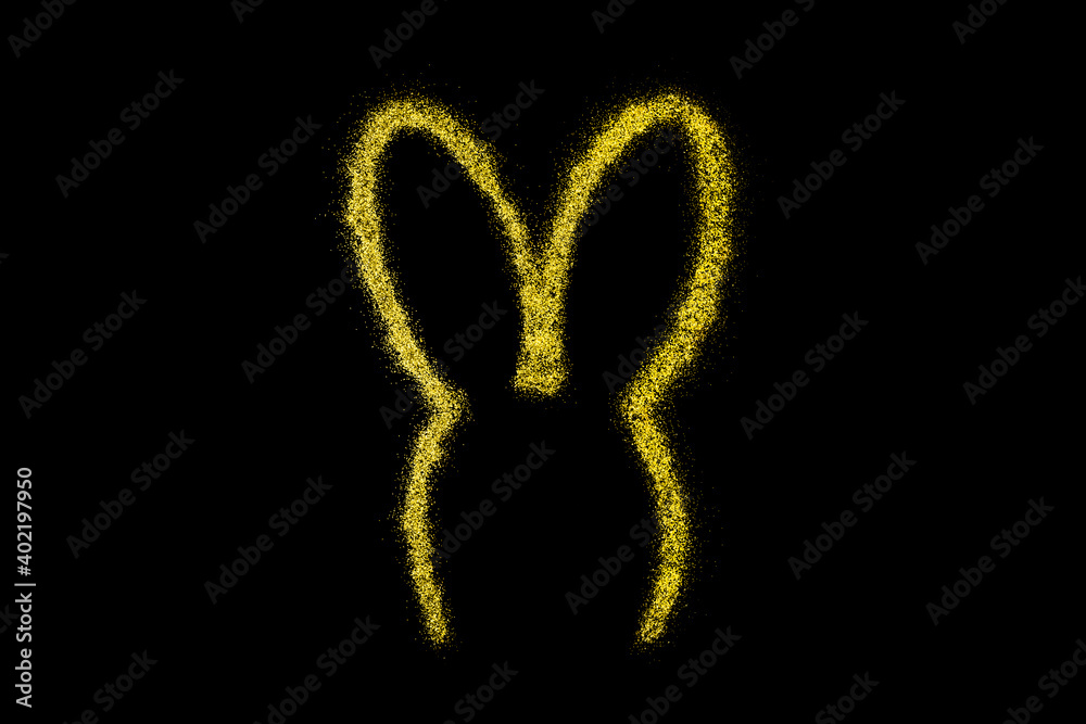 Bunny ears made from golden sparkles or glitter isolated on black background.