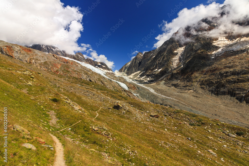 hikingpath in the lötschtal to the anenhütte house alm stone, rocks