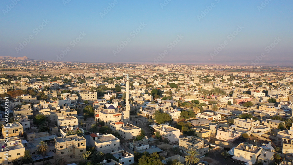 Mosque Tower minaret in Jericho city with Birds- aerial view
Drone view of Jericho city,sunset, Jordan Valley, Israel/palestine
