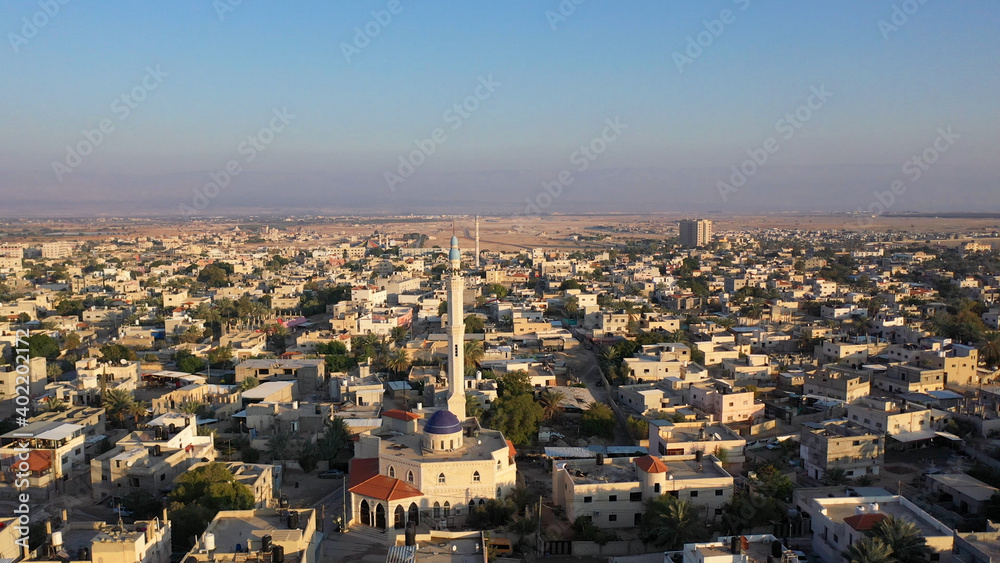 Mosque Tower minaret in Jericho city with Birds- aerial view
Drone view of Jericho city,sunset, Jordan Valley, Israel/palestine
