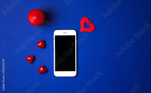 Valentine's Day modern didgital composition, social distancing concept and love messages, blue background top view photo