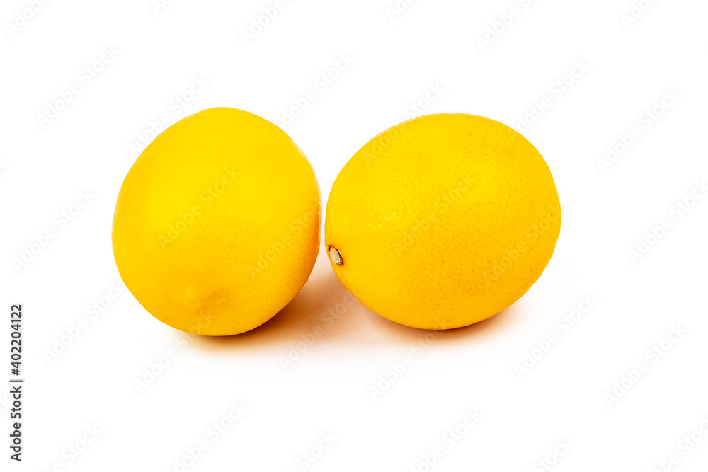 Studio lighting. white background. there are two yellow lemons on it. Close-up. Studio lighting. white background. there are two yellow lemons on it. Close-up.