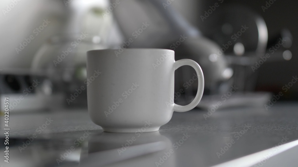 Coffee Cup Spinning Around and Standing on Kitchen Table Coffee Cup Spinning Around and Standing on Kitchen Table