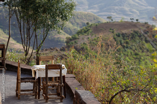 a table with chairs placed on the track to open a beautiful view of the landscape