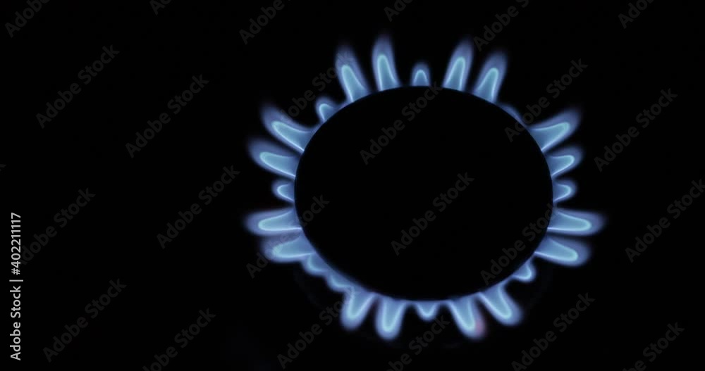 Blue gas flame, on gas comfort on a black background. Blue gas flame, on gas comfort on a black background.