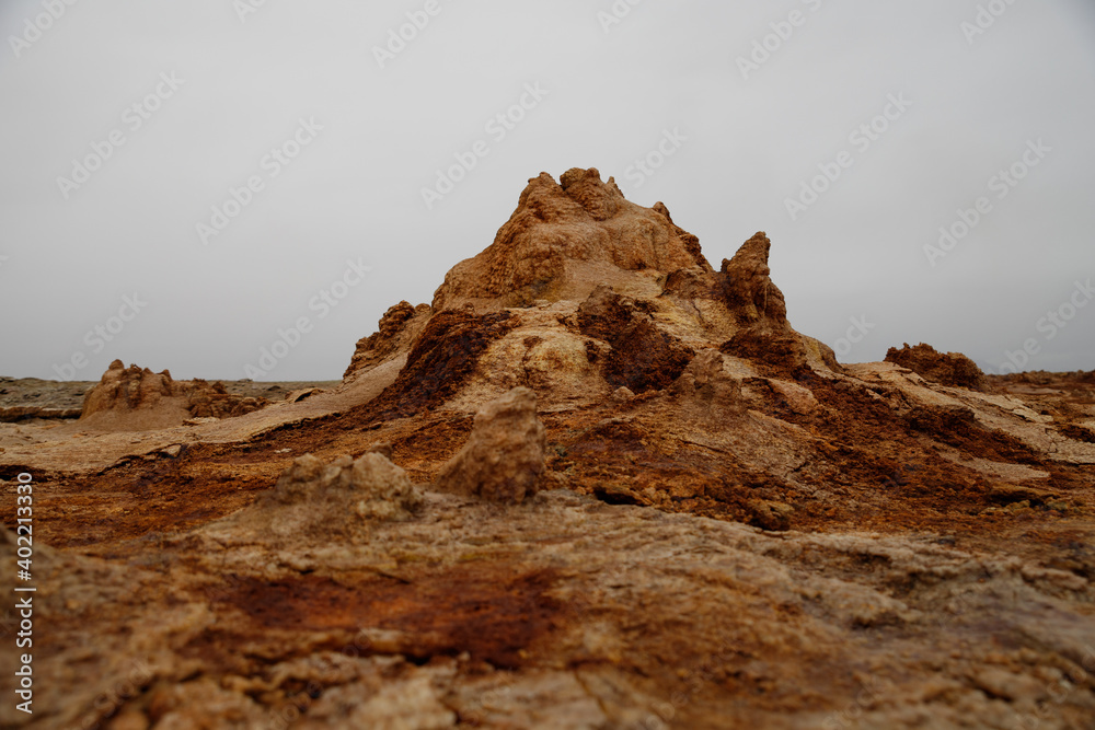 Fototapeta premium colored stones in a volcanic crater falling from the heat