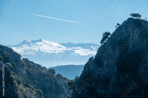 View of the three highest snow-capped peaks in Sierra Nevada from the Sierra de Huétor natural park