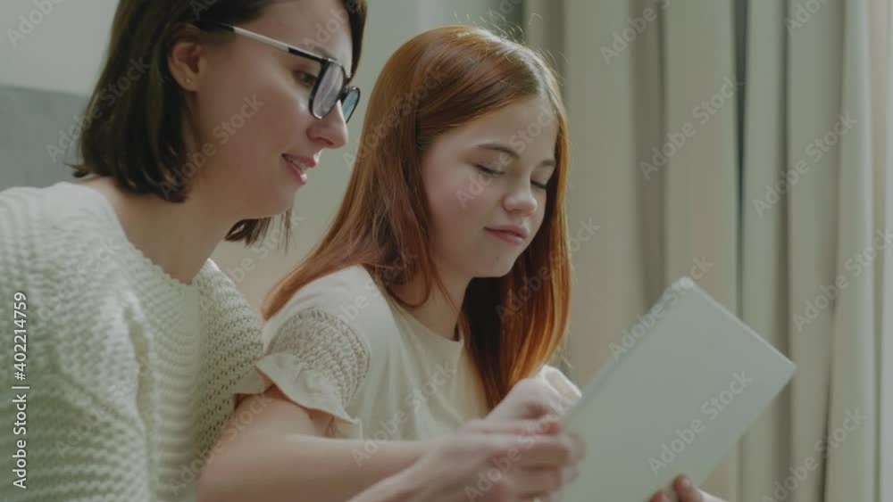 Girl Solve Math on Tablet With Mother Girl Solve Math on Tablet With Mother