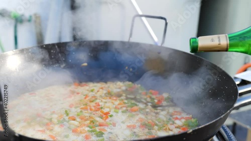 Sautéed vegetables in a paella pan ready for the preparation of a rice