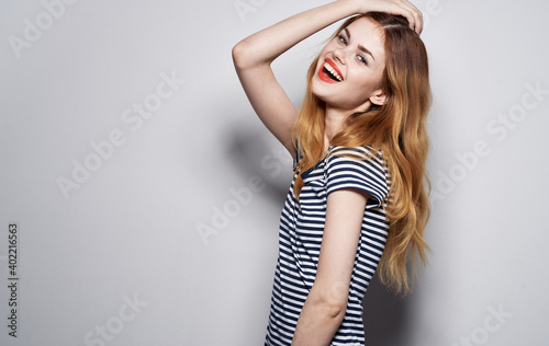 pretty woman in striped t-shirt glamor cosmetics decoration luxury studio model