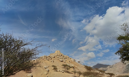 clouds over the mountains, Daia castle in Ras al Khaimah united Arab emirates   photo