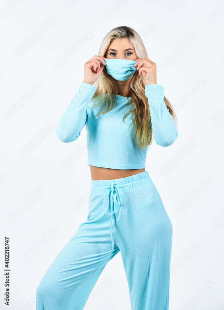 healthcare. doing sport while quarantine. blonde female wear medical mask on face. fit woman wear protective mask. coronavirus health protection. girl in respirator mask isolated on white healthcare. doing sport while quarantine. blonde female wear medical mask on face. fit woman wear protective mask. coronavirus health protection. girl in respirator mask isolated on white