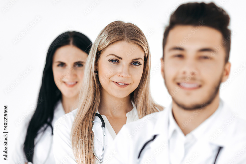 group of smiling hospital colleagues standing together group of smiling hospital colleagues standing together