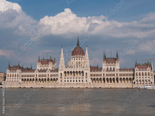 daytime front view of the hungarian parliament and river danube in budapest