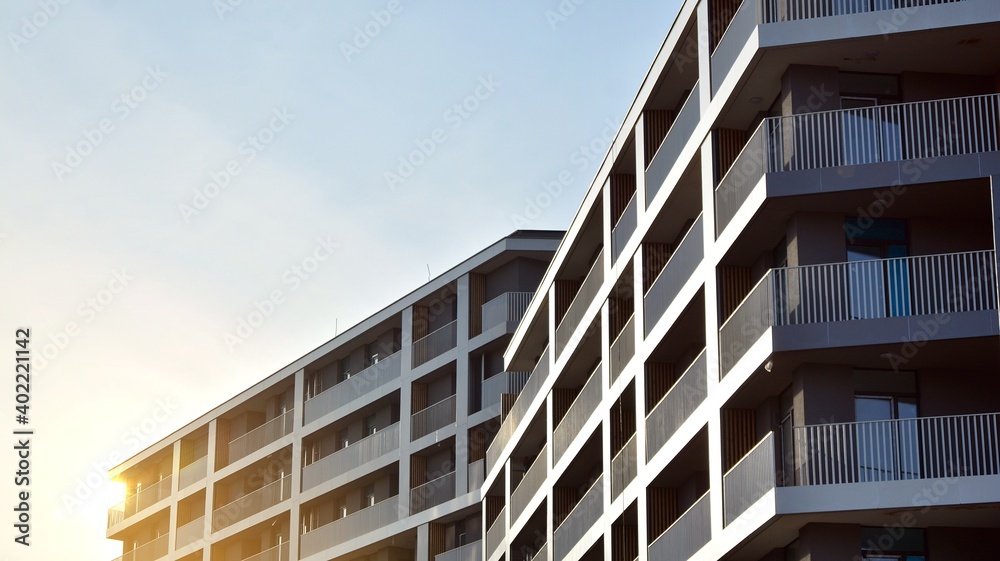 Apartment residential house and home facade architecture and outdoor facilities. Blue sky on the background. Sunlight Apartment residential house and home facade architecture and outdoor facilities. Blue sky on the background. Sunlight