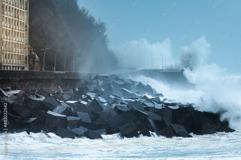 Fototapeta premium Waves breaking on the New Promenade of San Sebastian during the storm Bella, Spain