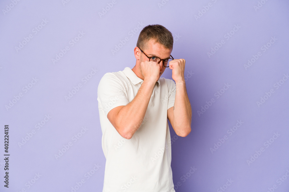 Young caucasian handsome man throwing a punch, anger, fighting due to an argument, boxing. Young caucasian handsome man throwing a punch, anger, fighting due to an argument, boxing.