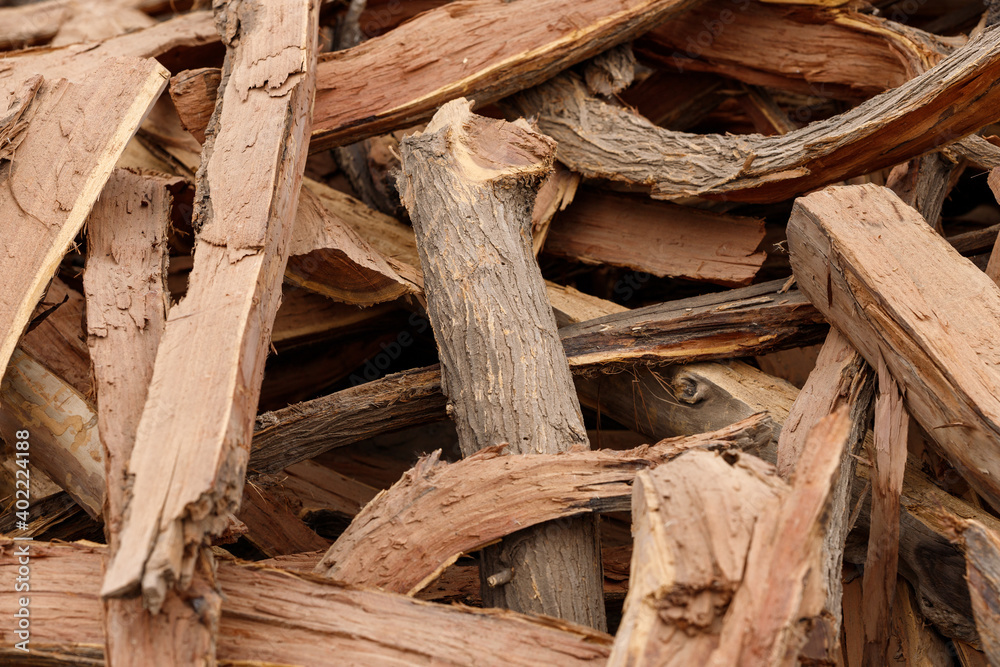 many pieces of wood stacked in a pile to form an interesting pattern many pieces of wood stacked in a pile to form an interesting pattern