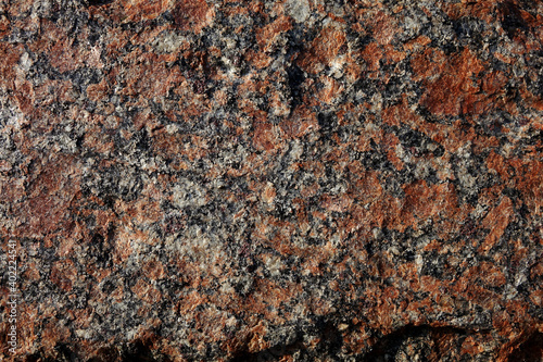 Red granite texture of decorative wall on the building