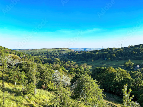 Landscape  Shibden Valley  on a late summers day  with old trees  fields  and a blue sky in  Halifax  Yorkshire  UK