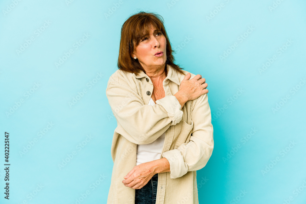 Senior caucasian woman isolated having a shoulder pain. Senior caucasian woman isolated having a shoulder pain.