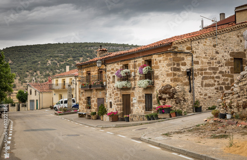 a street with typical houses in Cabrejas del Pinar town  province of Soria  Castile and Leon  Spain