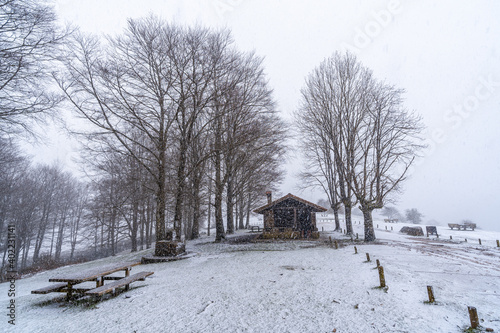 Refuge of mount aizkorri in gipuzkoa. Snowy landscape by winter snows. Basque Country, Spain photo