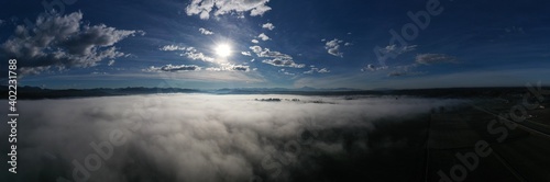 Fog starting to clear up  aerial above farmland