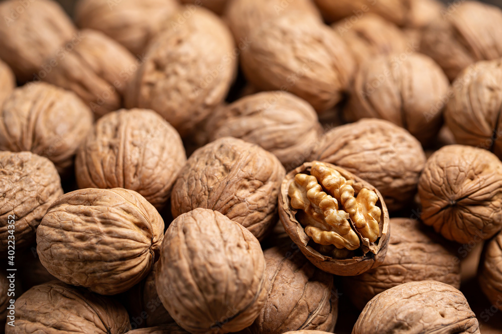 Whole Walnuts and one open closeup Whole Walnuts and one open closeup