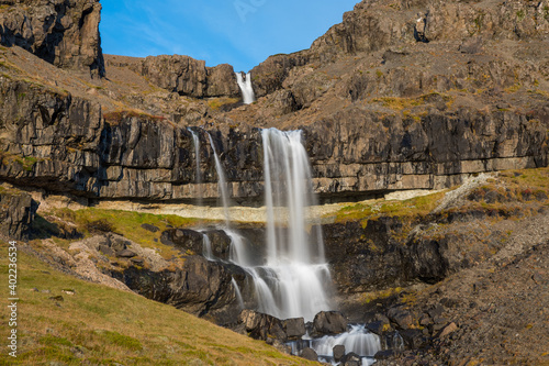 Waterfall Bergarfoss in Hornafjordur in south Icelandic countryside