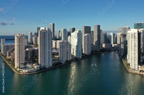 Miami, Florida - December 27, 2020 - Aerial view of City of Miami and entrance to Miami River on sunny winter morning. © Francisco